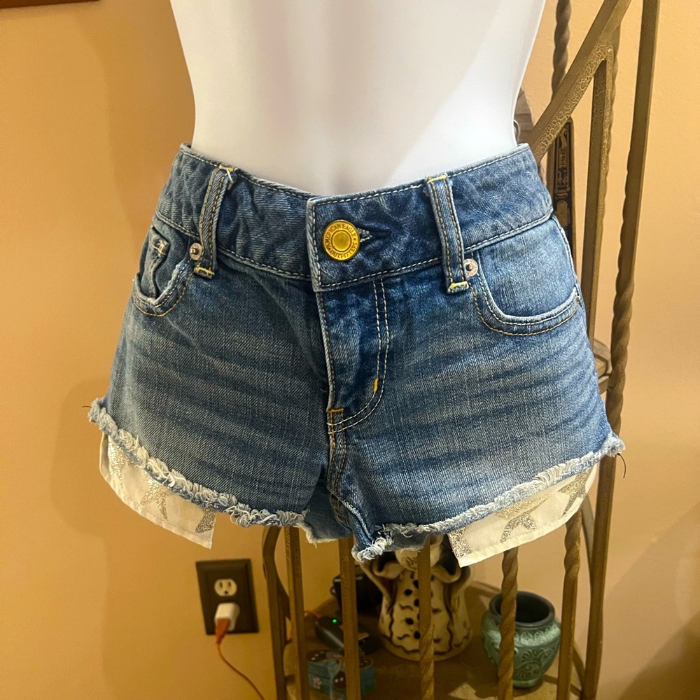 American Eagle Cut-Off Denim Shorts with Silver Glitter Star 🌟 showing Pockets
